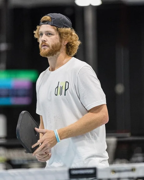 Tanner Rice, Dallas pickleball coach, at the kitchen line with a paddle